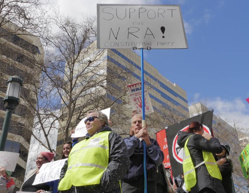 <strong> “I’m here today to represent sanity and defend the constitution," said Don Grundmann, San Jose, holds a sign in support of the National Rifle Association at the Oakland March for Our Lives event.</strong>