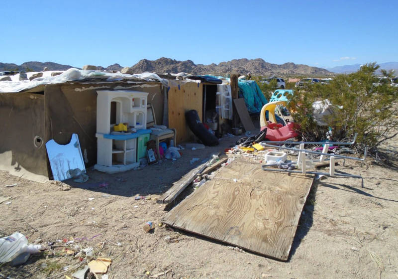 This handout photograph obtained March 1, 2018 courtesy of the San Bernardino County Sheriff's Department, Morongo Basin Station, shows the area in Joshua Tree where a couple were allegedly living with their three children inside a box for four years.
