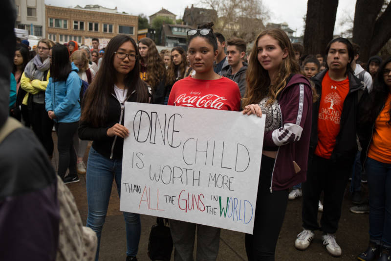 Students from Oakland Technical High School stand up against gun violence on March 14, 2018, one month after the school shooting in Parkland, Florida, killed 17 people. 