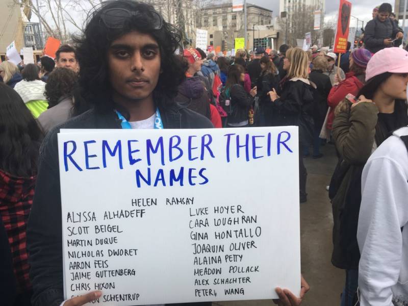 <strong>Eeshan Kumar, 18, is a senior at Prospect High School, made signs with the names of the victims of the shooting in Parkland, Florida, and handed them out at the rally in San Jose.</strong>