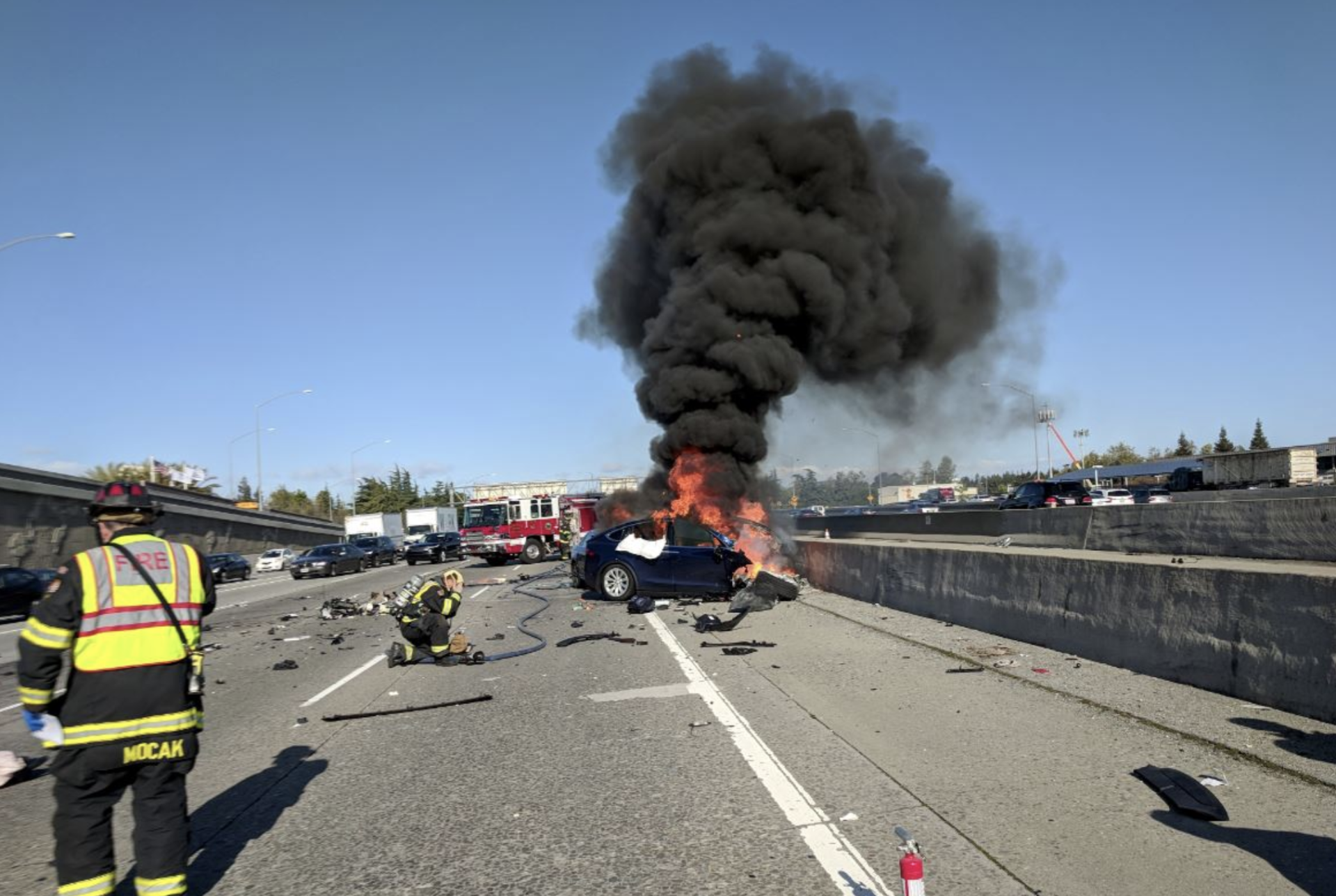 A Tesla Model X burns on U.S. 101 after crashing Friday morning in Mountain View.