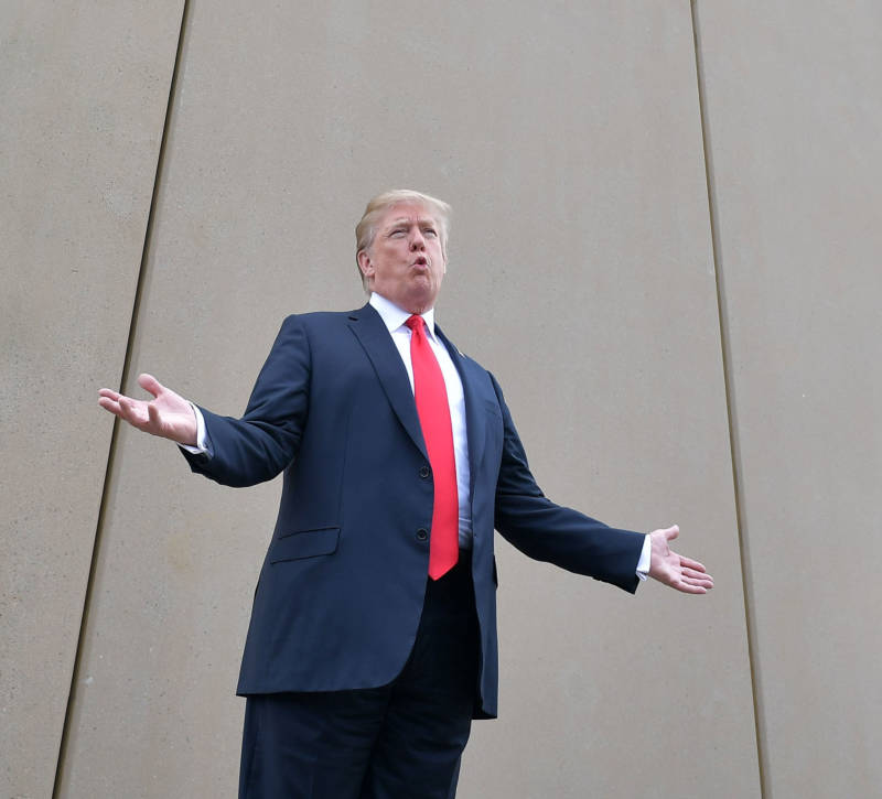 President Donald Trump speaks as he stands in front of a border wall prototype in San Diego on March 13, 2018.