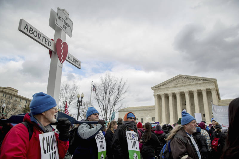 Anti-abortion activists converge in front of the Supreme Court last year during the annual "March for Life."
