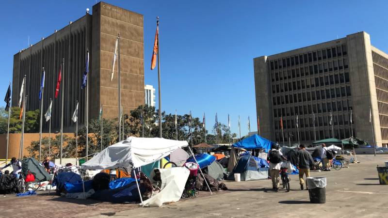 Orange County officials rescinded plans to establish three temporary shelters on county land near the ocean. Two blocks away from the hearing in Santa Ana, a sprawling homeless encampment remains in front of the courthouse.