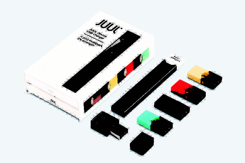 Colorful nicotine-filled pods, pictured on the right, are inserted into the Juul e-cigarette, which educators say looks deceptively like a flash drive, making it harder to identify.