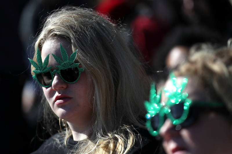 People wore pot-themed gear, like these marijuana leaf glasses, during a 420 celebration on 'Hippie Hill.'