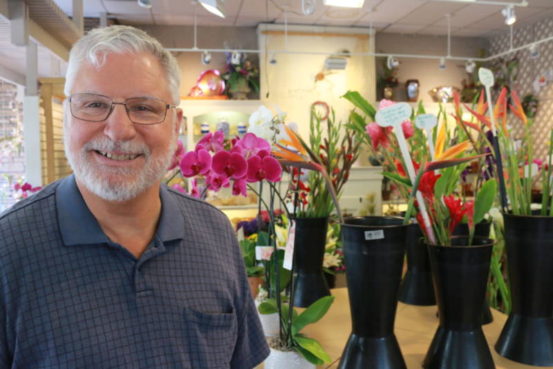 James Relles poses in the showroom of Relles Florist, a 71-year-old family-owned flower shop in Sacramento.  