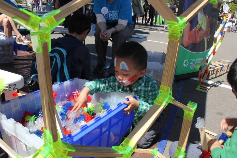 Two-year old Alvin Troung of Oakland checks out the play exhibit from the Lawrence Hall of Science at the Bay Area's 2018 March for Science.