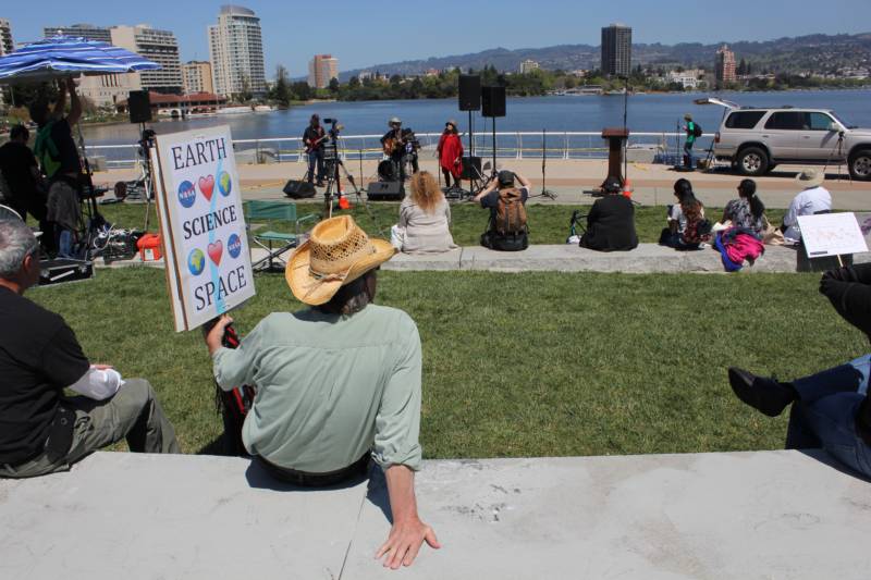 Jon Alexander of Pleasant Hill relaxes while listening to a science band at the March for Science.