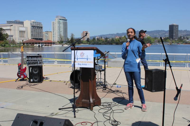 Future Stanford undergraduate Sahithi Pingali of Bangalore, India speaks to the crowd at Lake Merritt, in Oakland. Because of her work, a planet in the Milky Way was named in her honor.