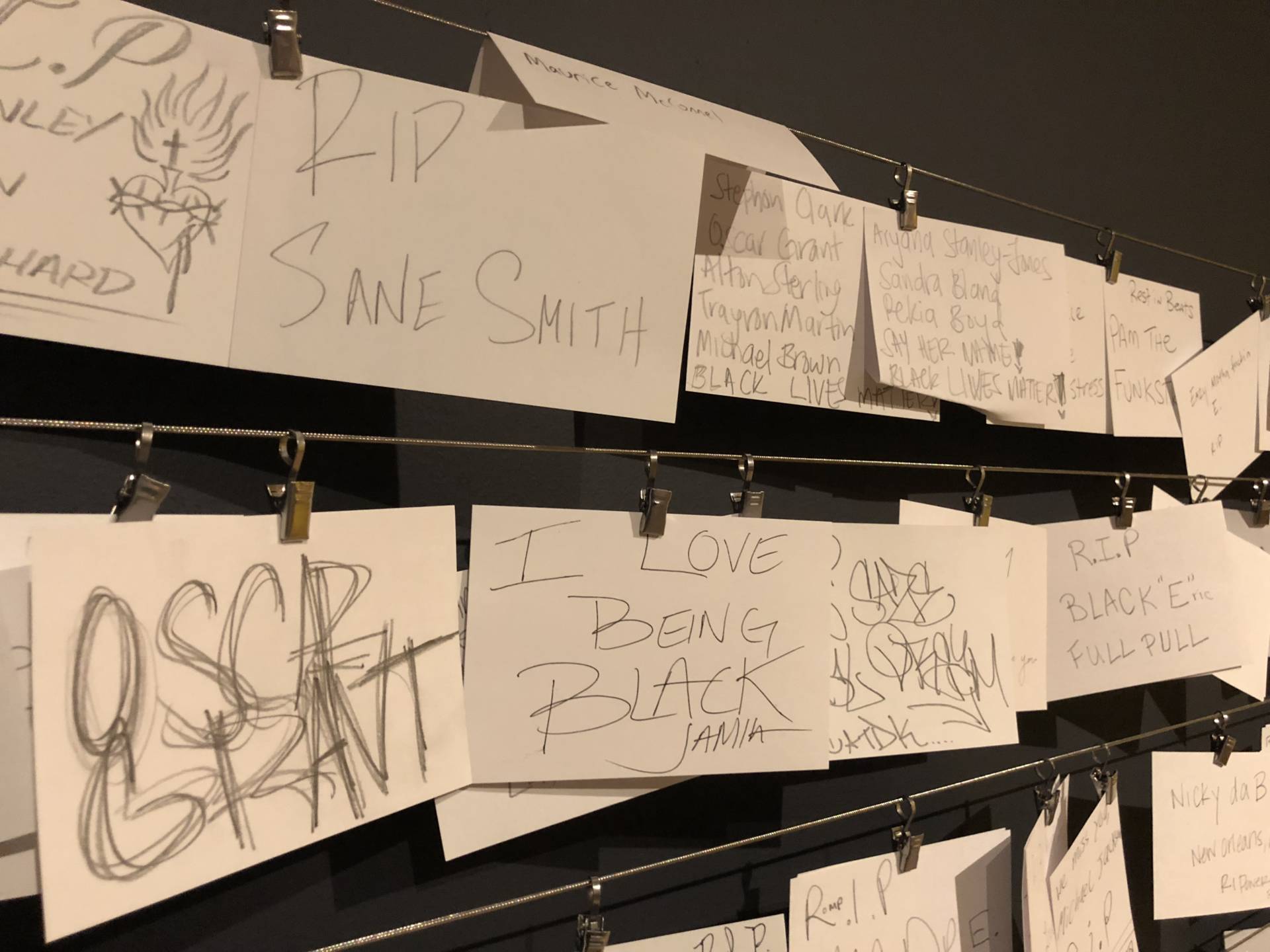 People can write their own memorials and hang them on the wall next to the street memorial.