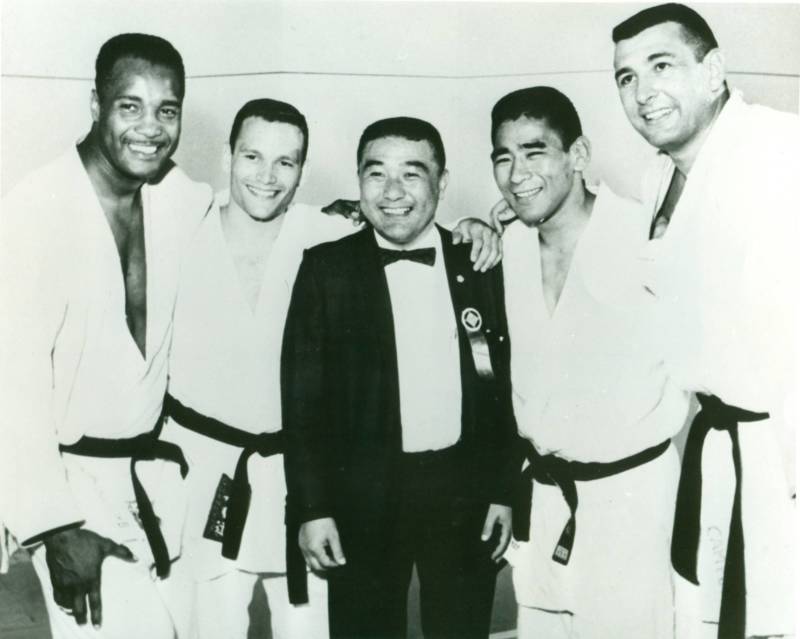 Yoshihiro Uchida at the 1964 Tokyo Olympics with George Lee Harris, Jim Bregman, Paul Maruyama and Ben Nighthorse Campbell.