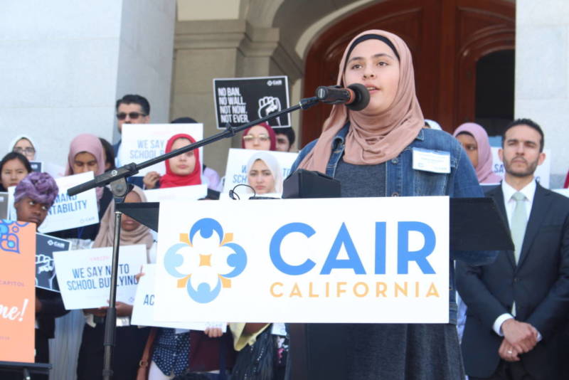 Yasmine Nayabkhil, 12, speaks before cameras and reporters in support of an anti-bullying bill at the Sacramento capitol on April 23, 2018. The Council on American-Islamic Relations organized the event. 