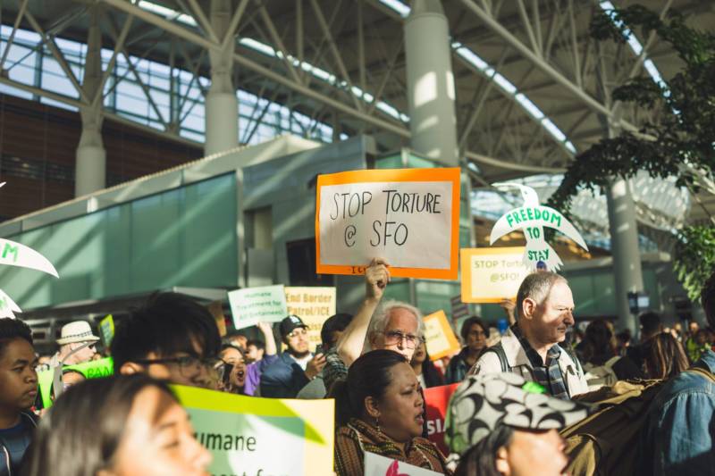 Jerome Aba's supporters protest at SFO on April 17, 2018.