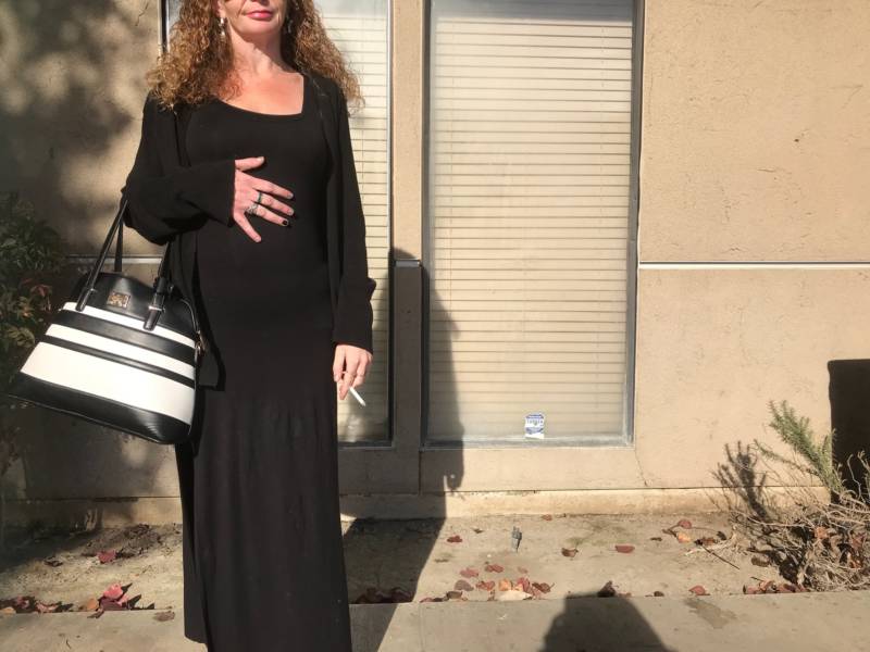 Amanda, pregnant, standing outside a methadone clinic in Fresno.