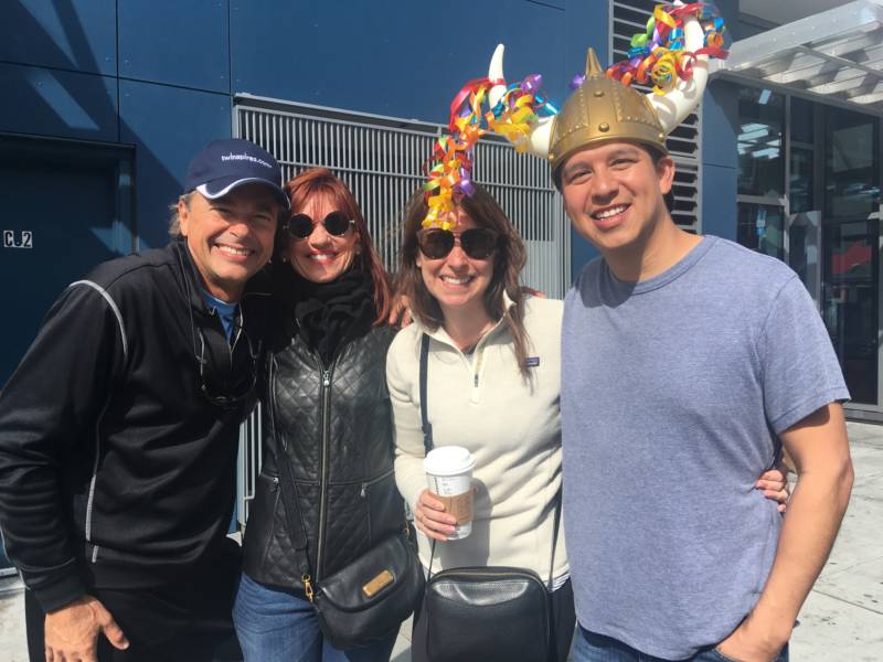 San Francisco residents Seth and Sarah Hernandez (right) bring along visiting relatives Lori and Mike Solomon to witness the festivities. Race organizers say approximately 150,000 spectators lined the route on Sunday.