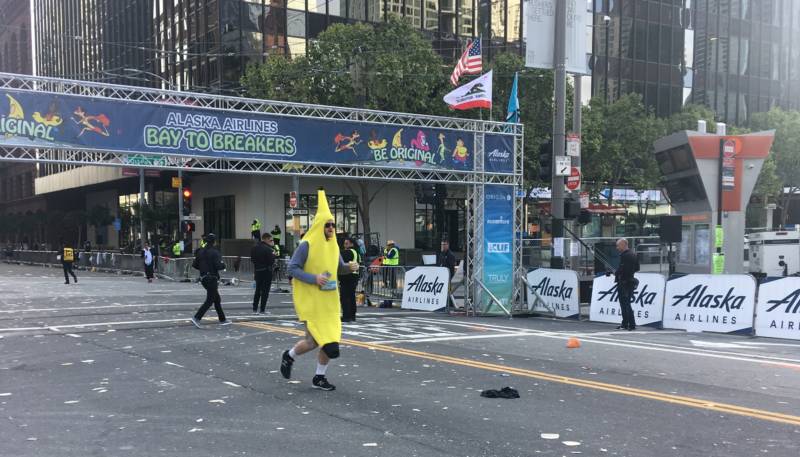 A lone racer, dressed as a banana, is seen at the Bay to Breakers starting line.
