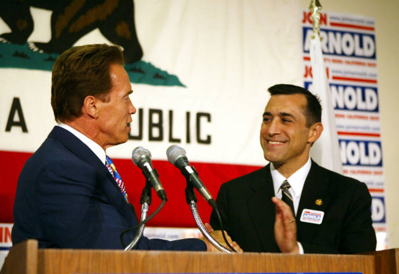 Rep. Darrell Issa and then-gubernatorial candidate Arnold Schwarzenegger shake hands September 26, 2003 in Santa Monica.