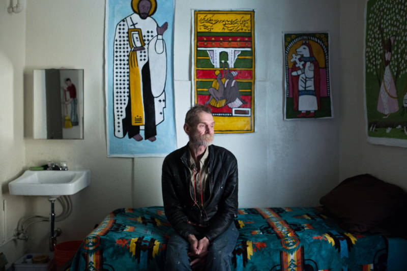 Jeff Marshal sits in his single-room occupancy hotel room, or SRO, in the Tenderloin. The neighborhood has the most SROs in the city, which have helped stave off gentrification.