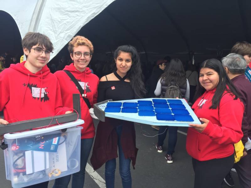 The Berkeley High School Robotics Team shows off part of their solar-powered racing robot. “It’s basically like a three wheel designed to get aerodynamic so it can go very quickly in the race field and beat the other robots,“ said team member Cecilia Estrada.
