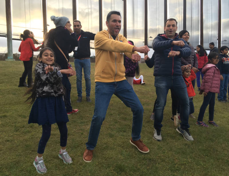 Manu Singh (middle) of San José dances with his daughter, Sahana, to Benny Dayal's version of 'Gangnam Style. He says everybody can get into the "peppy beats" of Indian music.