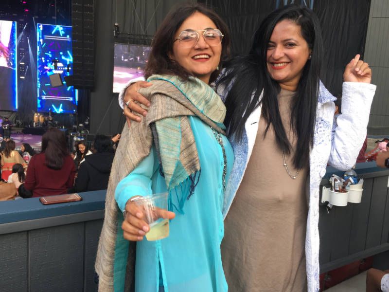 Sarhya Laranth and Meenalshi of Palo Alto dance along to Bollywood star Benny Dayal at the Gaana Music Festival in Mountain View. They were most excited to see musician Arijit Singh, who also preformed.