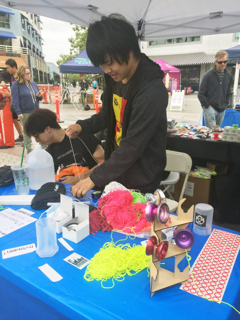 Tyler Hsieh, 23, works a vendor booth at the Bay Area Classic. He has his own line of yo-yos called UNPRLD. He said he didn't like the models that were available when he started yo-yo-ing 10 years ago, so he started his own brand.