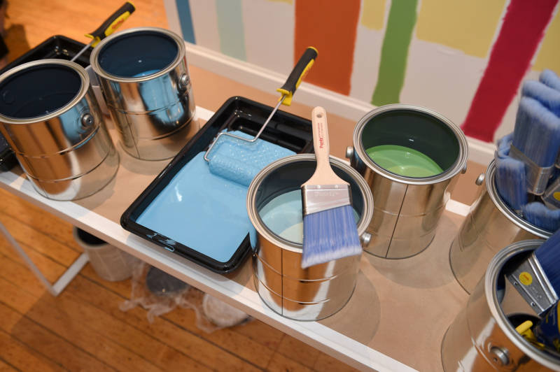 Sherwin Williams paint cans at a promotional event in 2015. Sherwin Williams is one of three paint companies working to overturn a ruling that says they must pay to clean up lead paint in older homes across California.