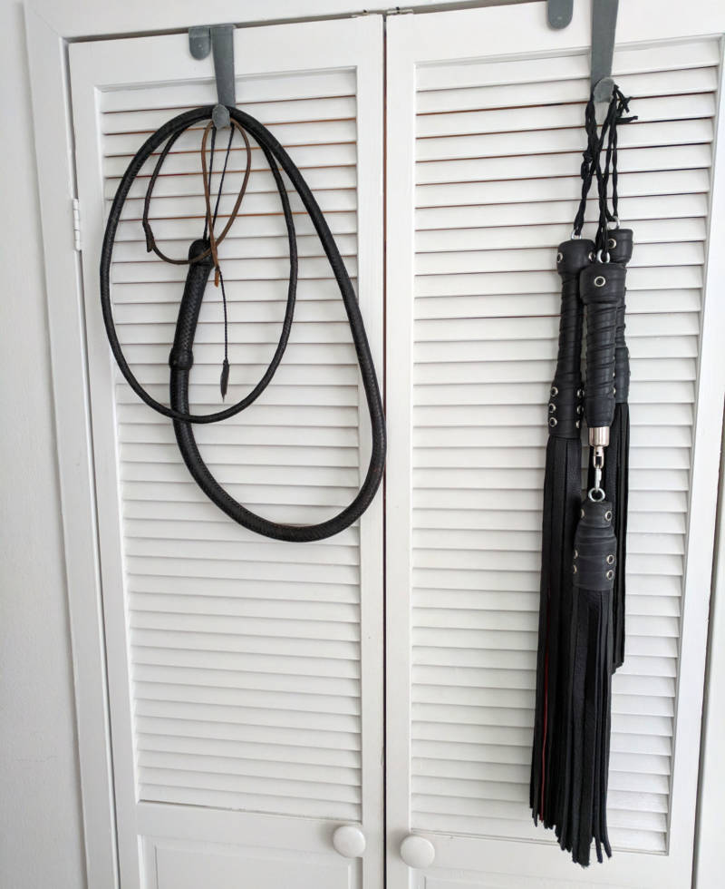 Grace’s whip and collection of floggers. They range from supple deer skin to brutally tough bull hide.