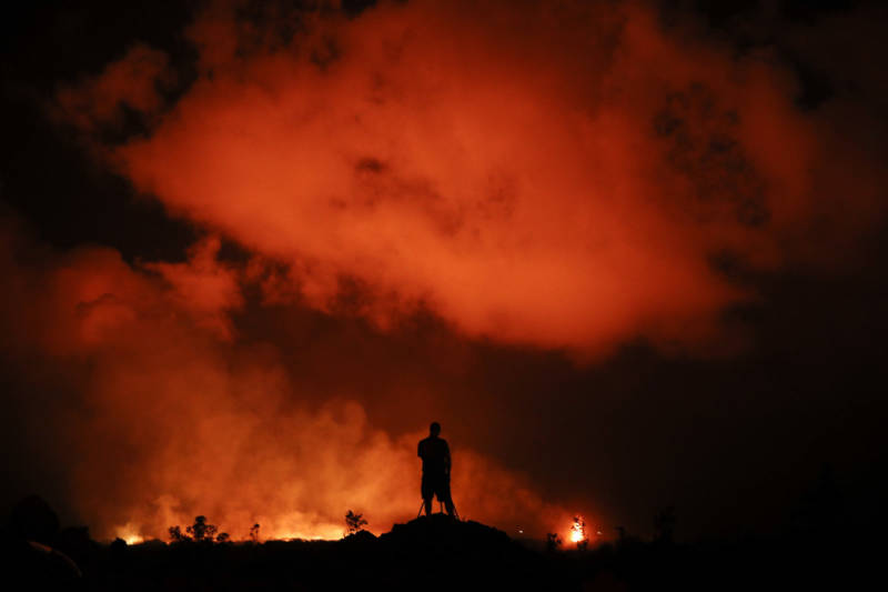 Peter Vance, 24, photographs lava erupting in Leilani Estates on Friday.