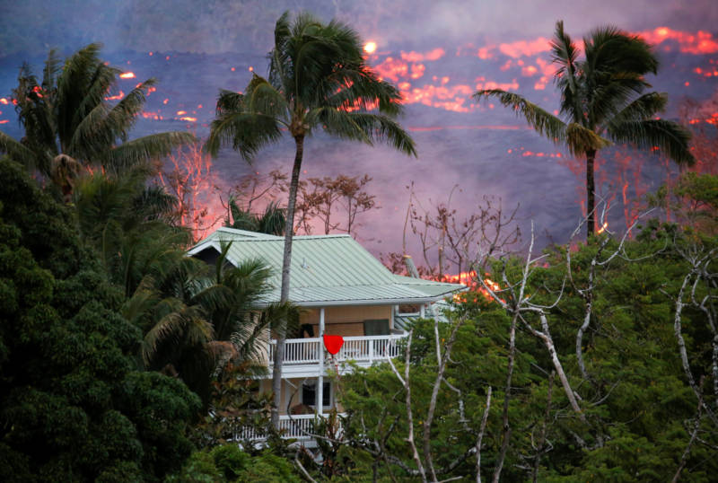 Lava flows near a house on the outskirts of Pahoa.