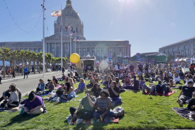 Festivalgoers relax at Civic Center Plaza in San Francisco during Clusterfest. The festival premiered in June 2017, and organizers said more than 45,000 people attended over its initial three-day run.