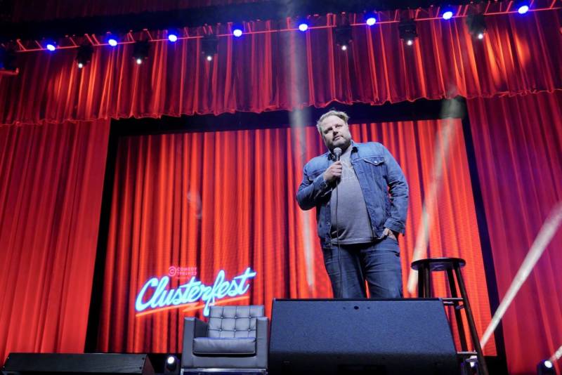 Marine biologist turned stand-up comedian Forrest Shaw performs onstage inside Bill Graham Civic Auditorium at Clusterfest.