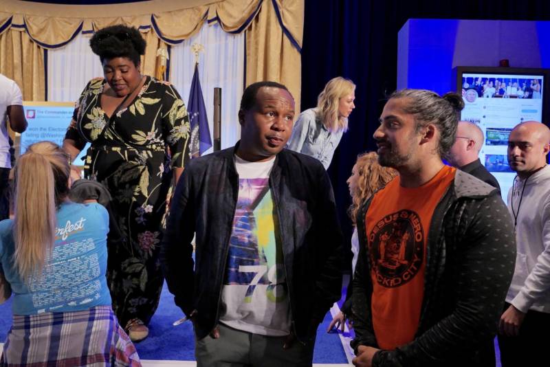The Daily Show correspondent Roy Wood, Jr. talks to a festival goer inside the Donald J. Trump Presidential Twitter Library at Clusterfest. Wood Jr. performed three times during the weekend.