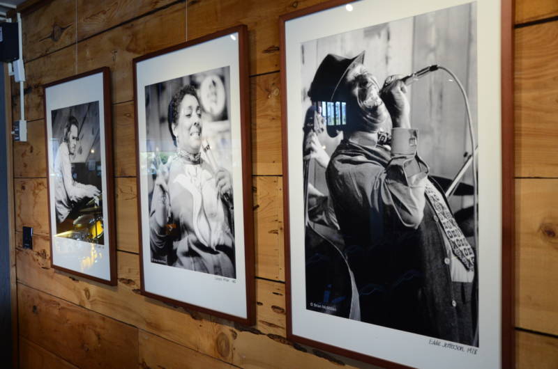 Photos of jazz greats including Carmen McRae, Bill Evans and Eddie Jackson line the wood-paneled walls of the present-day Bach concert room.