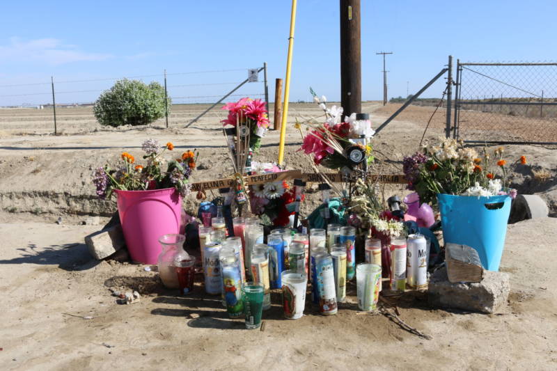 A roadside memorial to Santos Hilario Garcia and Marcelina Garcia Perfecto, who died while fleeing ICE agents on March 13, still stood at the site of the accident on a rural road in Delano over two months later.