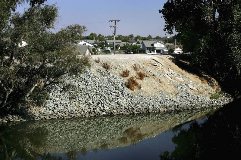A levee holding back the waters of the Sacramento-San Joaquin River Delta in Stockton, pictured in 2005.
