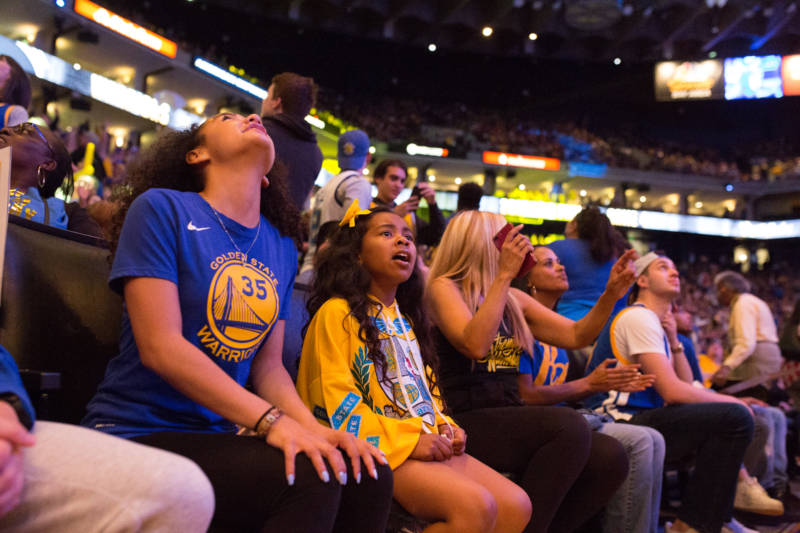 Fans react to the last minutes of the 4th quarter as the Warriors secure their win over the Cleveland Cavaliers on June 8, 2018.