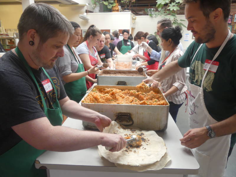 Once the assembly line got going, a mix of regular and newbie volunteers were able to put together hundreds of burritos in an hour.