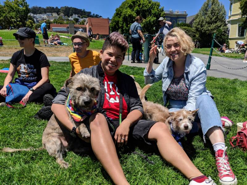 Sarah Buyco (left) and Tyler Weber (right) with their dog Penny, a pit bull / terrier mix who was born without a fourth leg. 'She's forever a puppy, super happy and friendly,' says Weber. They both fostered other dogs with Wonder Dog Rescue in San Francisco.