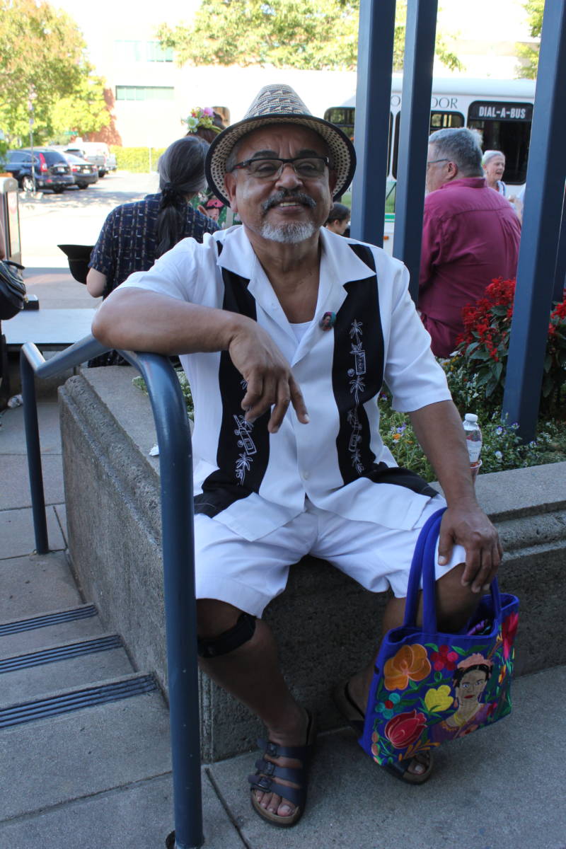 Ed Flores of Martinez relaxes at the Frida Kahlo celebration outside Bedford Gallery in Walnut Creek. Flores said Kahlo was the "revolution before the revolution" when it came to women's empowerment, "ahead of her time."
