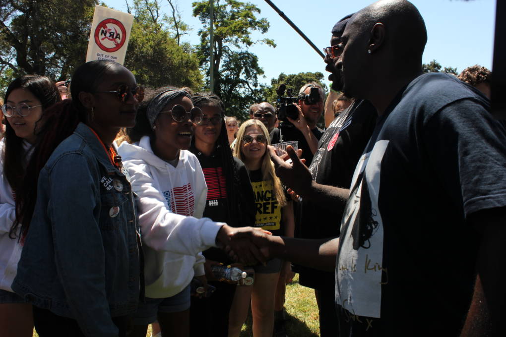 (L-R) Bria Smith of Milwaukee, Wisconsin (17) and fellow March for Our Lives tour participant Ariel Hobbs of Houston, Texas (20) greet their Oakland hosts, Kenzie Smith and Onsayo Abram, of "barbecuing while black" notoriety.