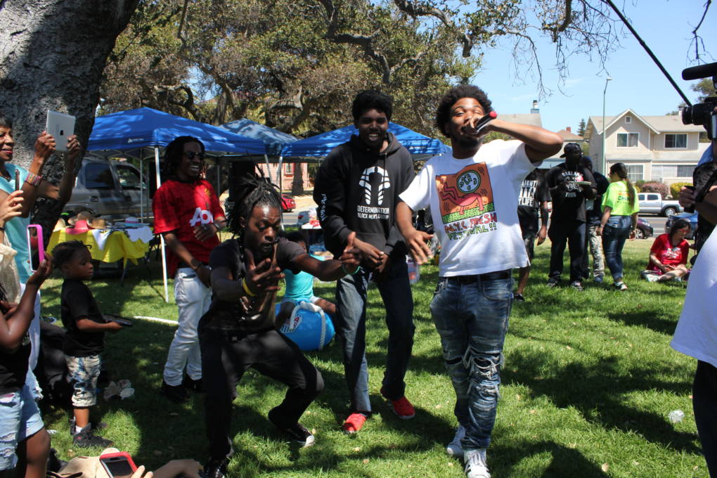 Members of Urban Peace Movement, L-R Erik Wright, Roy Terry, Ronnie Coleman and Jamel Patterson rap "3am in Oakland" at the March for Our Lives barbecue. Wright says, "I hope we do all the things we're talking about at the barbecue, vote, and positivity."