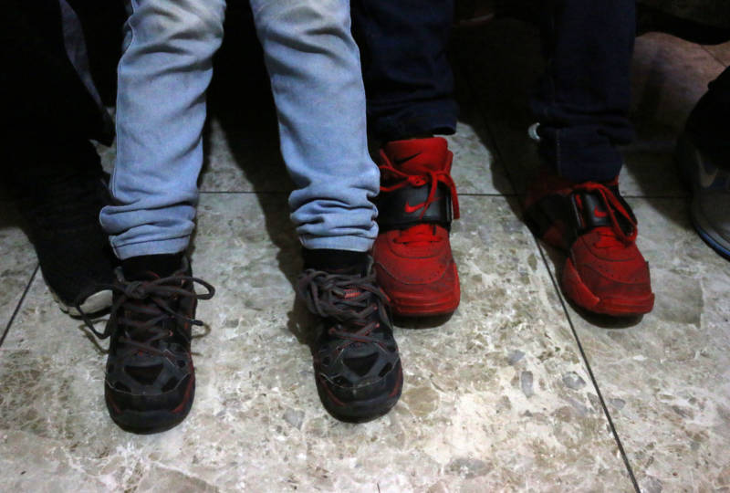 Elizabet’s five and nine-year-old sons’ shoes. The boys repeatedly told their mother they were hungry while in Customs and Border Protection custody at the Calexico West border facility.