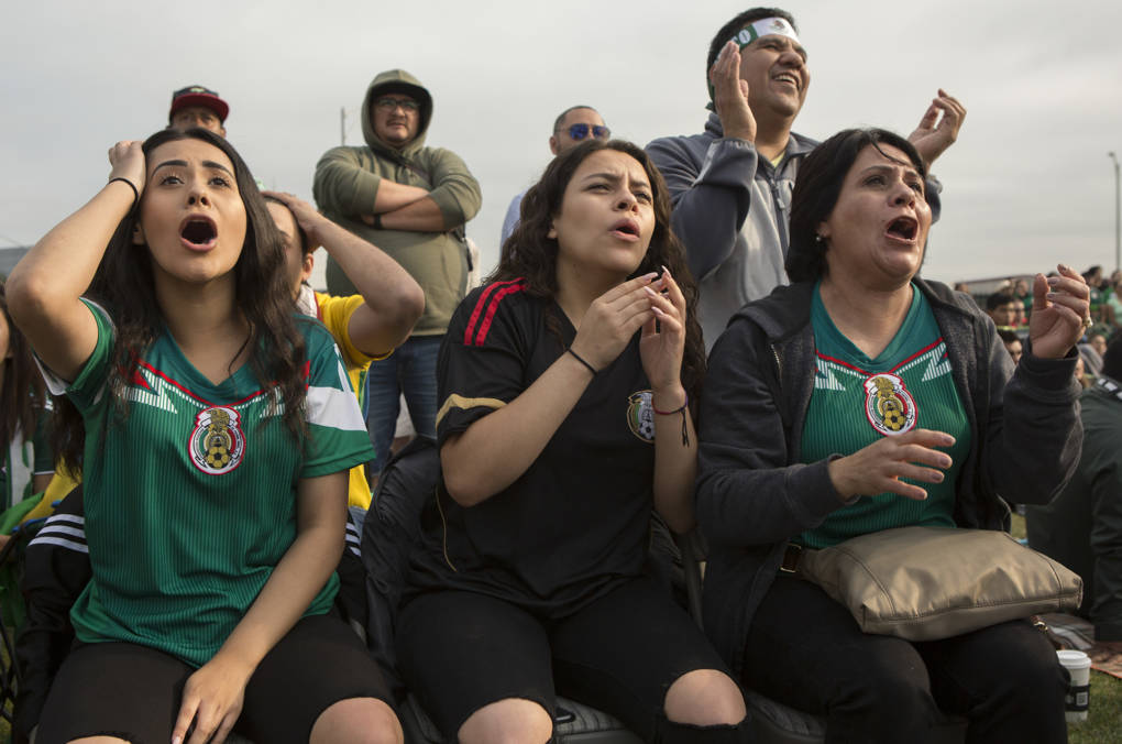 From left: Nicole Villegas, Juli Castro and Edilia Vidal of San Bruno react to the game, which remained 1-0 for the majority of the second half and was stressful for Mexico fans who desperately wanted to see their team move into the quarter finals. "I can feel my heart beating so fast," said Castro. "High anxiety for sure!"