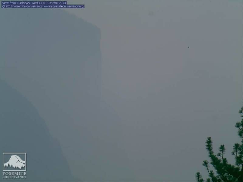 A view of El Capitan in Yosemite National Park obscured by smoke from the Ferguson Fire on July 18, 2018.