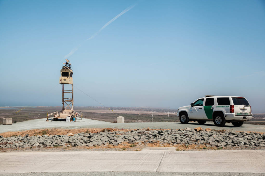 A Border Patrol SUV looks over the U.S.-Mexico Border in the "Bunker Hill" district near Tijuana, Mexico.