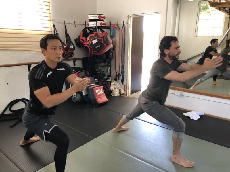 Daniel Wu and his trainer, Matt Lucas, work out at The Open Matt, a dojo in Oakland.