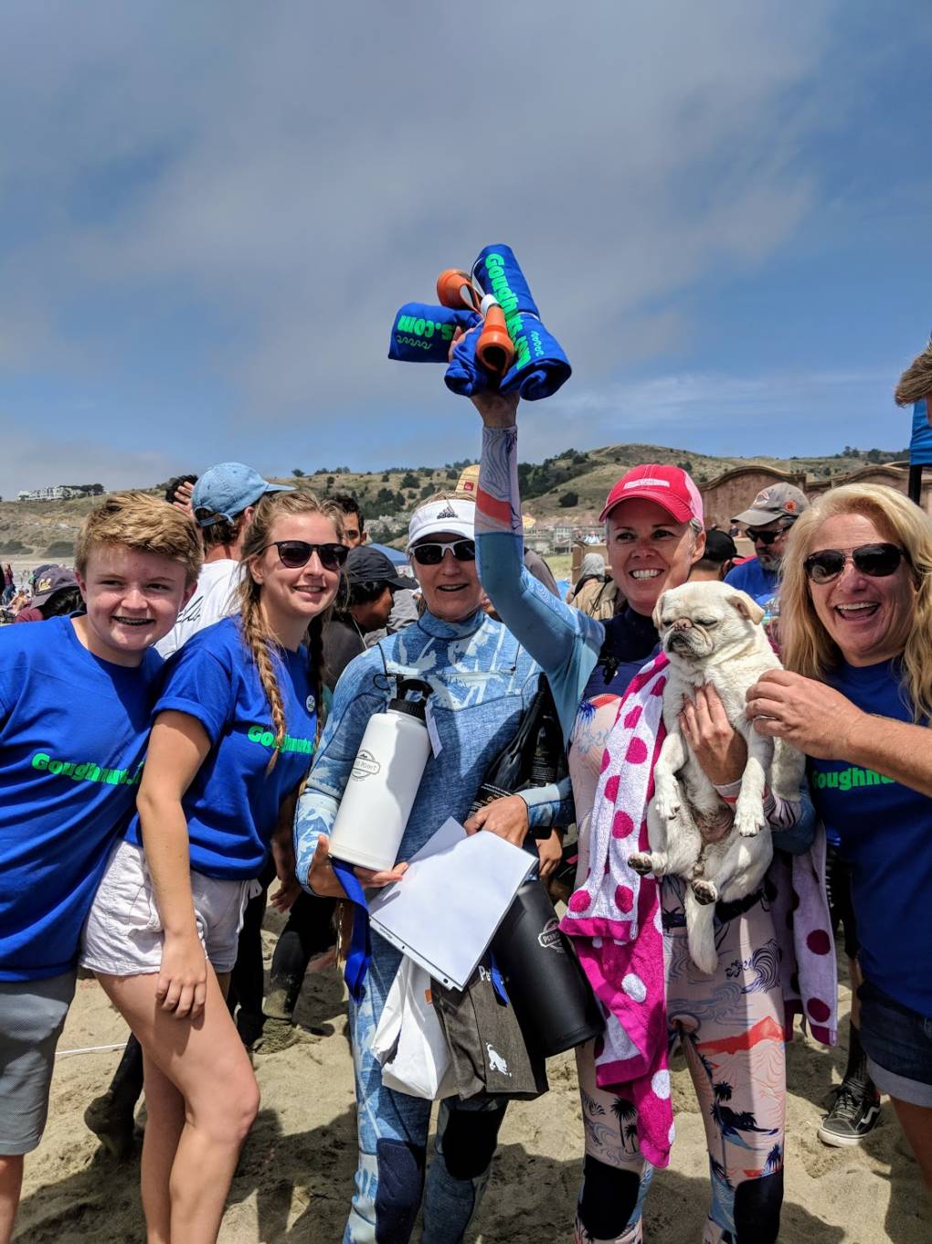 "Top Dog" Gidget and her owners Fiona Kempin and Alecia Nelson pose for pictures after her big win. Gidget does tricks like 360 turns and 'walking the board' during her surf events.