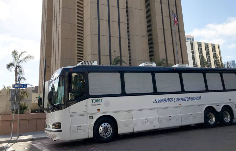 Migrants facing criminal charges for entering the U.S. illegally are bused to the Metropolitan Correctional Center in downtown San Diego.